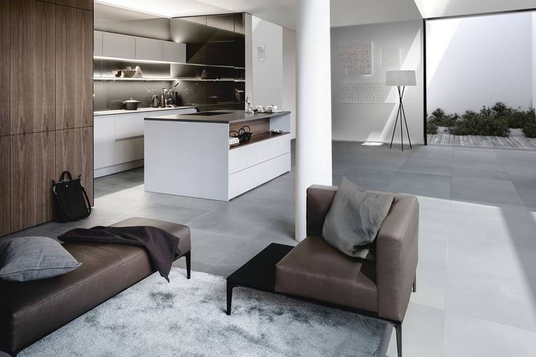 SieMatic Pure S2 SE tall cabinets in noble walnut veneer meld kitchen and living areas